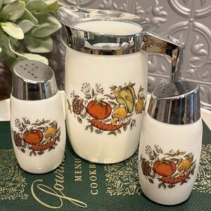 Vintage glass condiment set with chrome lids and handle.
